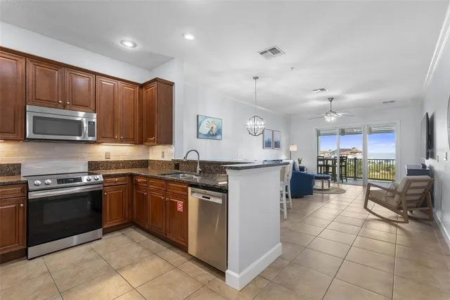 a kitchen with a sink and counter top space