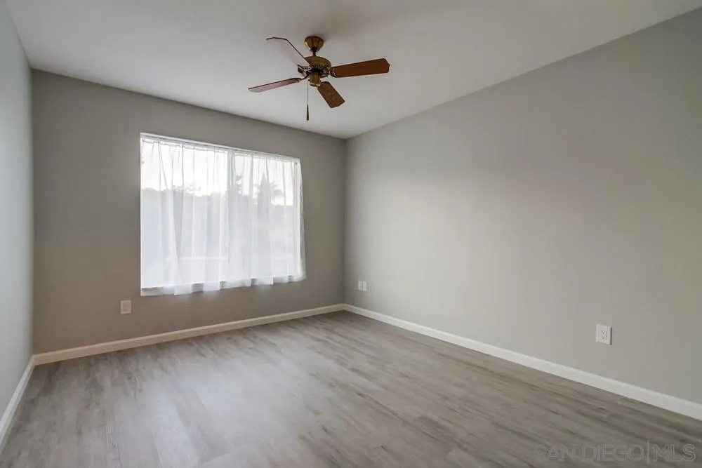 4729 Sunrise Ridge Oceanside, CA 92056 - Photo 8 of 22 wooden floor in an empty room with a window