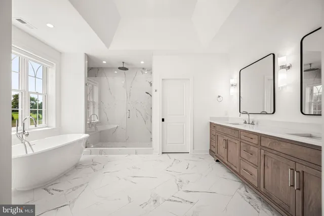 a utility room with sink dryer and washer