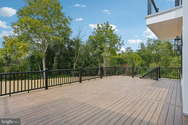 a view of a house with backyard sitting area and porch