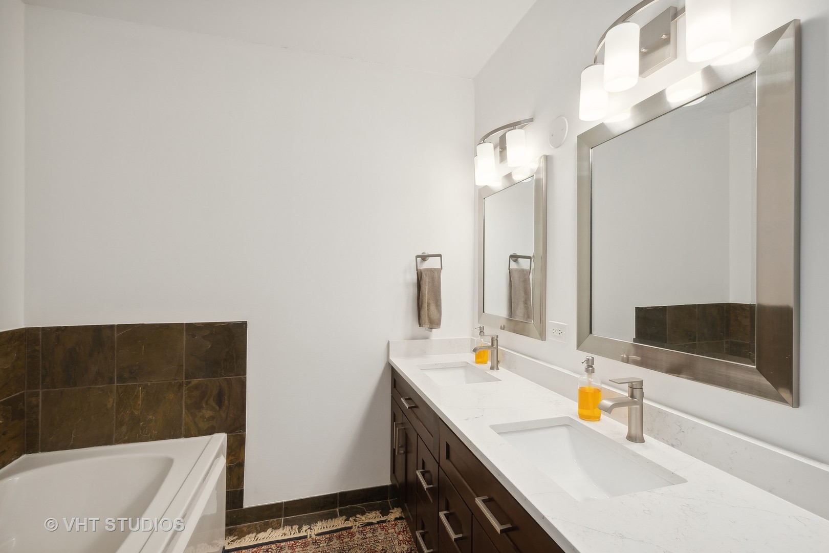 1101 South State Street, Unit 1800 Chicago, IL 60605 - Photo 12 of 18 a bathroom with a sink and a mirror