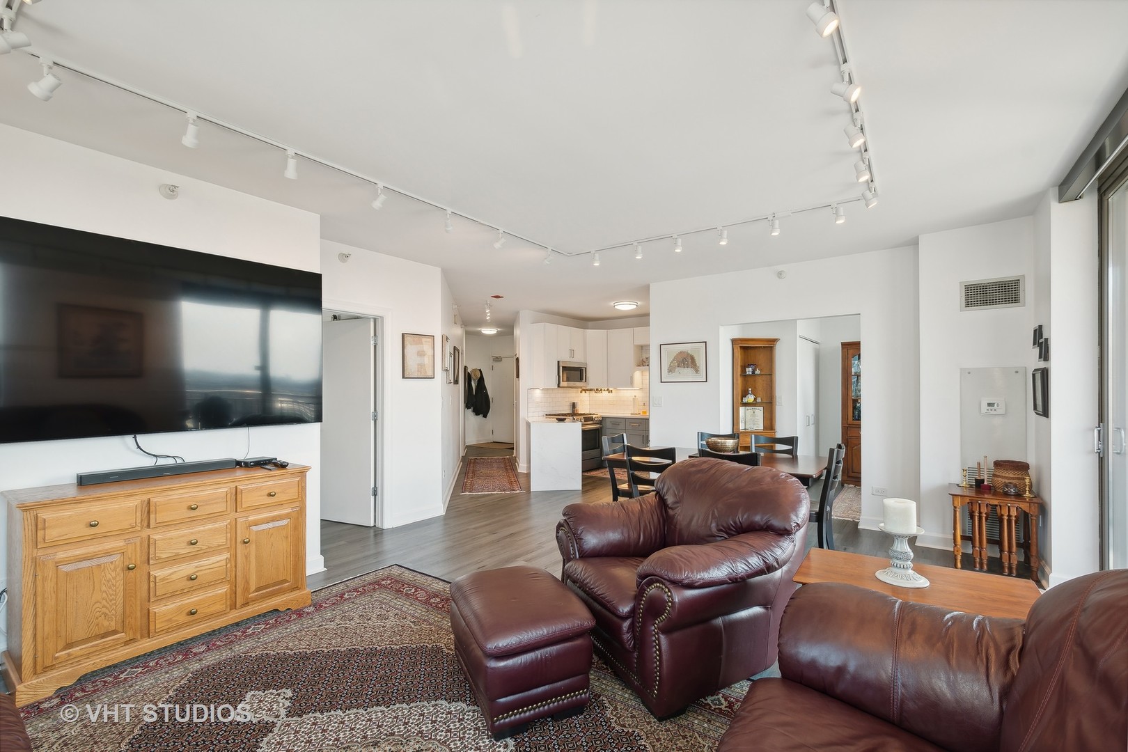 1101 South State Street, Unit 1800 Chicago, IL 60605 - Photo 3 of 18 a living room with furniture and a flat screen tv
