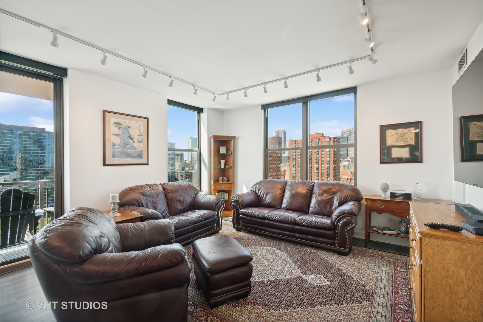 1101 South State Street, Unit 1800 Chicago, IL 60605 - Photo 5 of 18 a living room with furniture and a large window