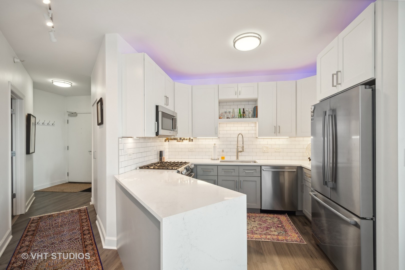 1101 South State Street, Unit 1800 Chicago, IL 60605 - Photo 6 of 18 a kitchen with a sink a refrigerator a oven and cabinets