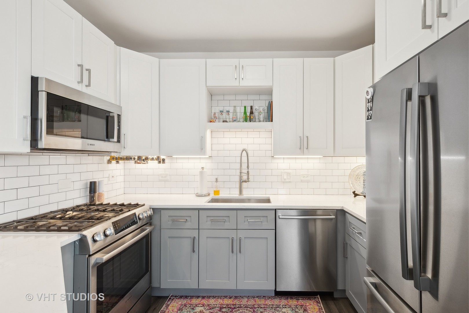 1101 South State Street, Unit 1800 Chicago, IL 60605 - Photo 7 of 18 a kitchen with a sink stove and refrigerator