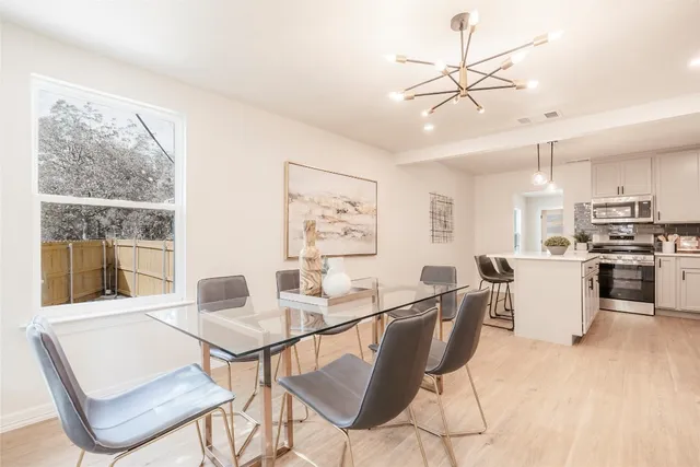 a view of a dining room with furniture window and outside view