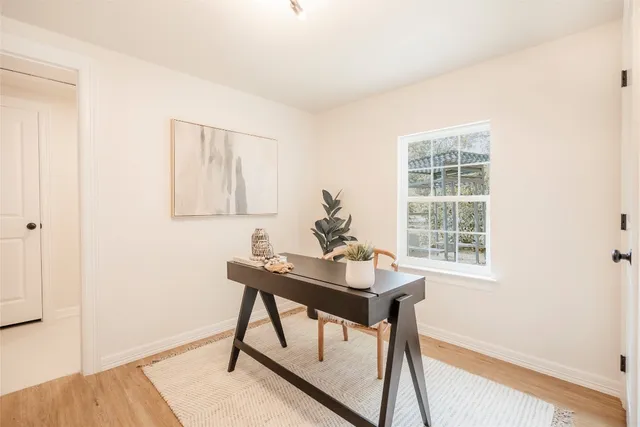 a workspace with furniture and a window