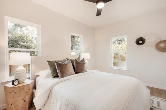 a bedroom with a bed and a window