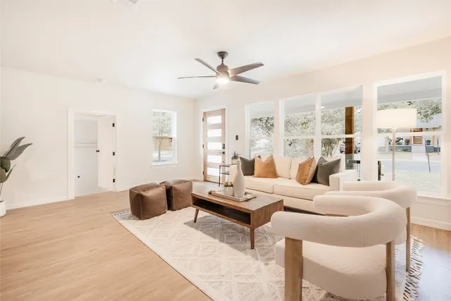 a living room with furniture and a large window