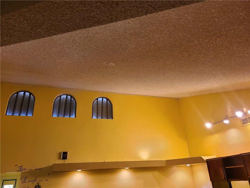 8107 Hibiscus Circle, Unit 30 Tamarac, FL 33321 - Photo 5 of 9 a view of an empty room and floor to ceiling window