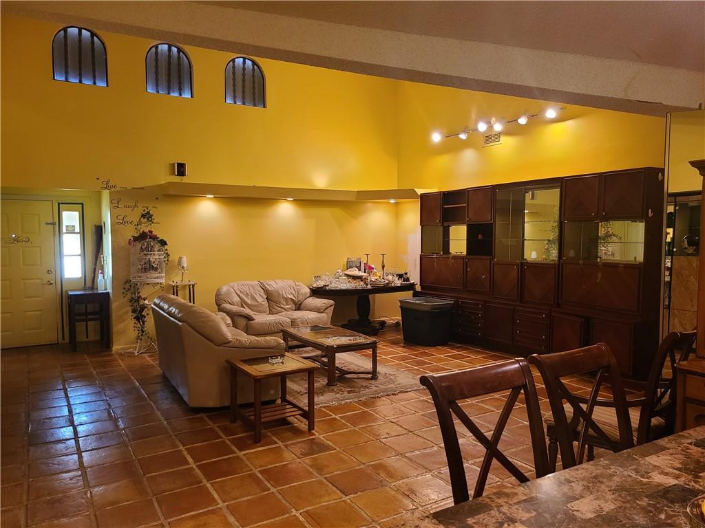 8107 Hibiscus Circle, Unit 30 Tamarac, FL 33321 - Photo 6 of 9 a balcony with table and chairs