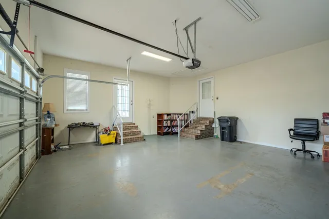 a view of a livingroom with furniture and a ceiling fan