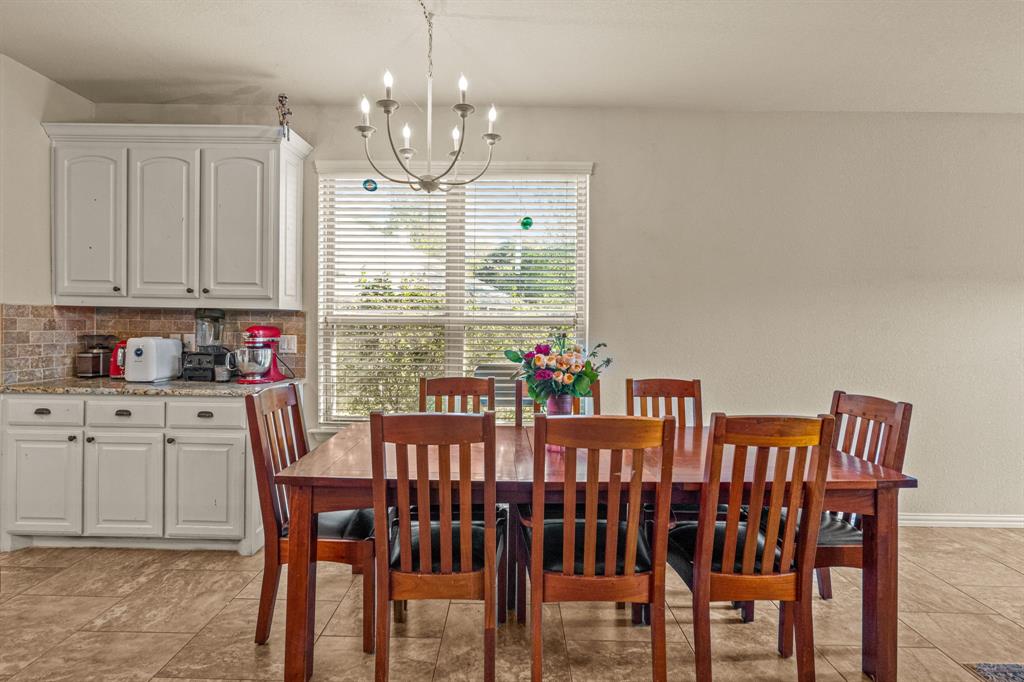 108 Bosque Court Azle, TX 76020 - Photo 18 of 37 a view of a dining room with furniture window and outside view