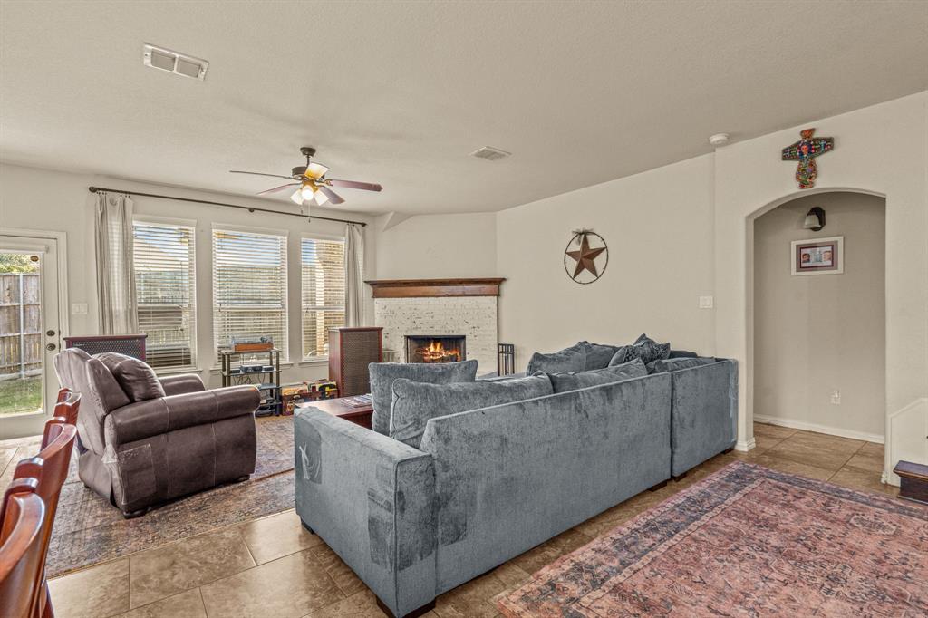 108 Bosque Court Azle, TX 76020 - Photo 20 of 37 a living room with furniture and a fireplace