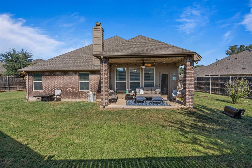 108 Bosque Court Azle, TX 76020 - Photo 27 of 37 a front view of a house with garden