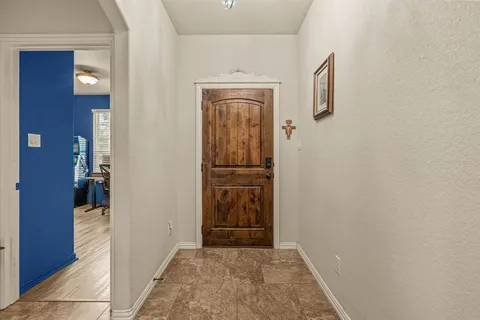 a view of hallway with door