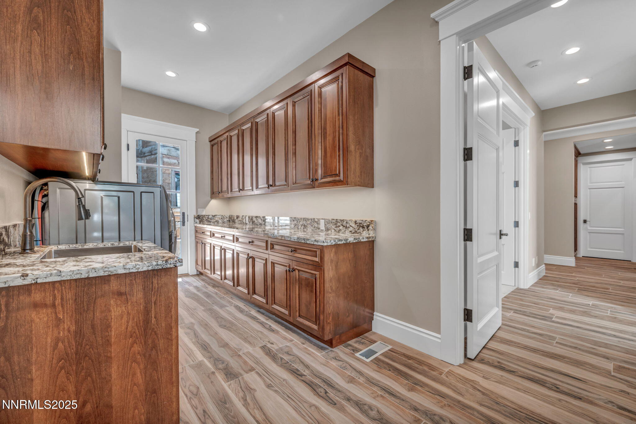 6145 Triple Crown Drive Reno, NV 89511 - Photo 35 of 45 a kitchen with stainless steel appliances granite countertop a stove a sink and a refrigerator