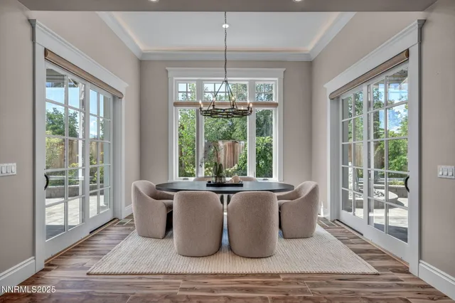 a dining room with furniture and wooden floor