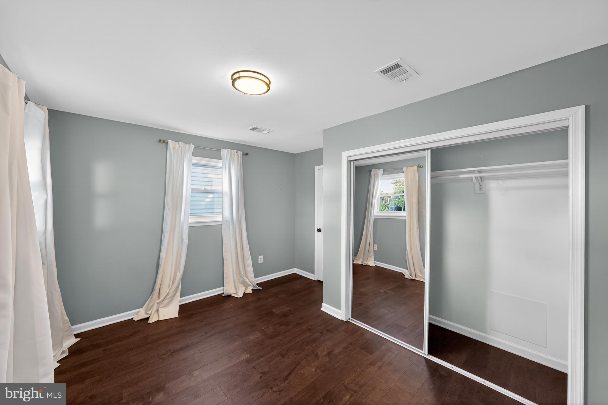 3670 5th Avenue Edgewater, MD 21037 - Photo 27 of 60 an entryway at an empty room with wooden floor