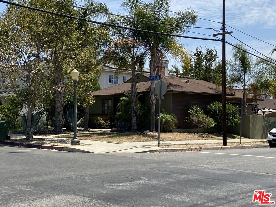 10596 Blythe Avenue Los Angeles, CA 90064 - Photo 1 of 1 a view of a street with a building in the background