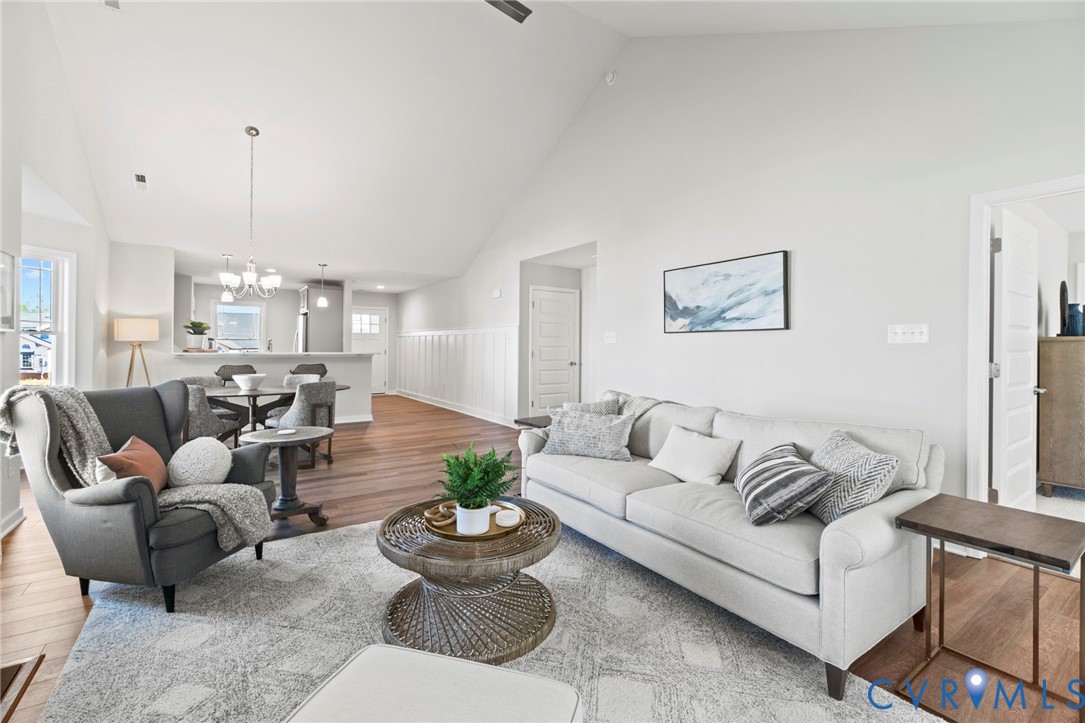 113 Logan Way Tappahannock, VA 22560 - Photo 11 of 33 a living room with furniture and a chandelier