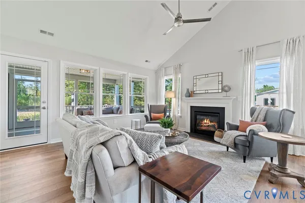 a living room with furniture and a fireplace