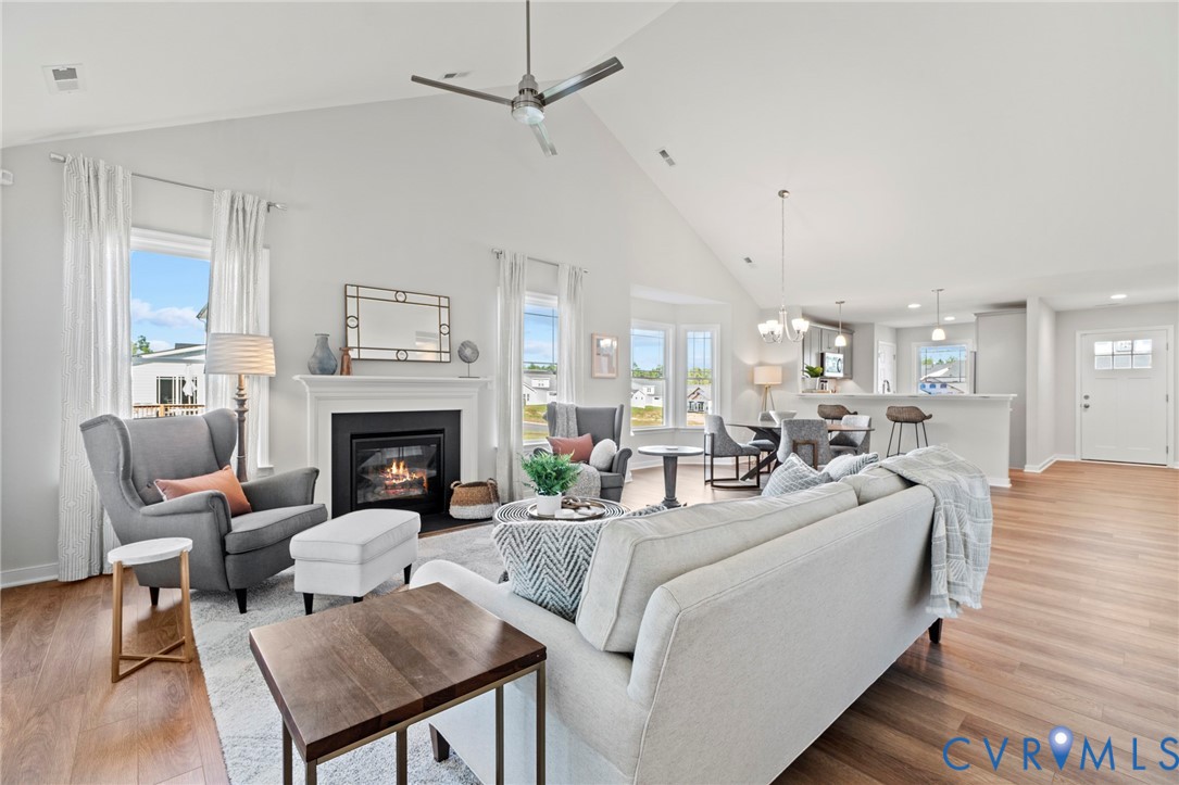 113 Logan Way Tappahannock, VA 22560 - Photo 15 of 33 a living room with furniture a fireplace and a table
