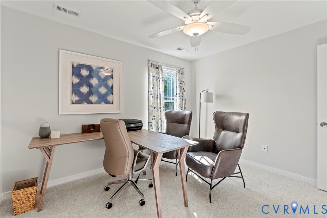 113 Logan Way Tappahannock, VA 22560 - Photo 21 of 33 a view of a livingroom with furniture and a chandelier