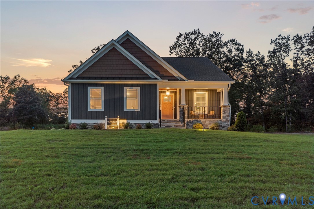 113 Logan Way Tappahannock, VA 22560 - Photo 33 of 33 a front view of a house with a garden