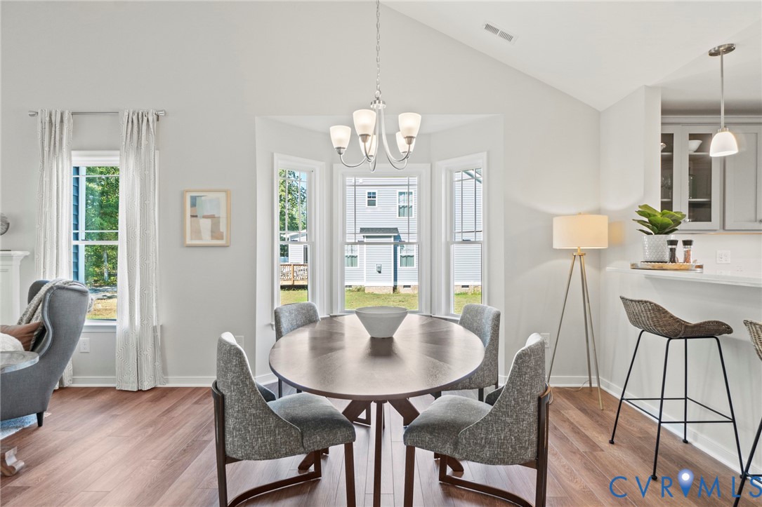 113 Logan Way Tappahannock, VA 22560 - Photo 10 of 33 a view of a dining room with furniture window and wooden floor