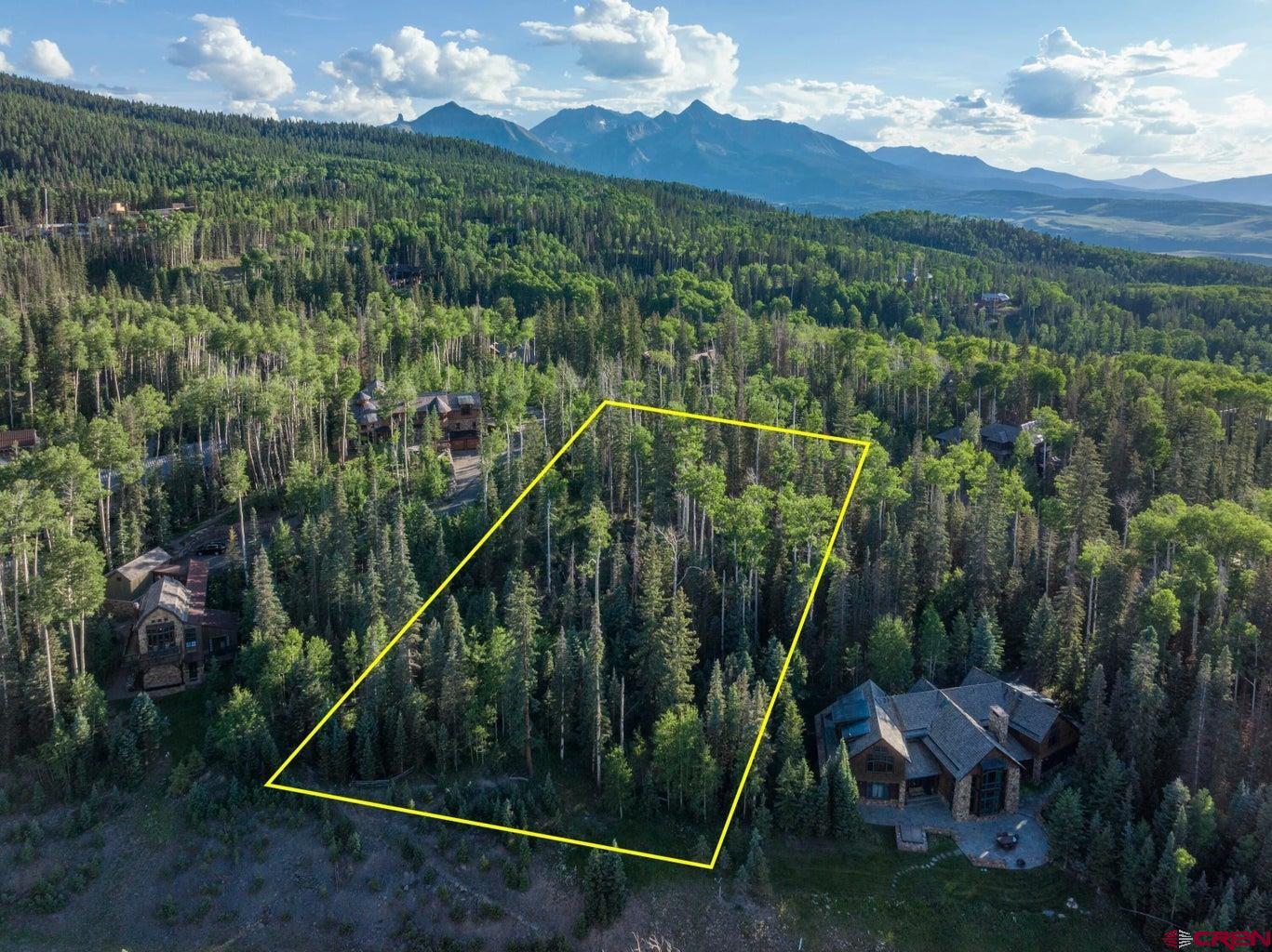 Tbd Lot 333 Benchmark Drive Telluride, CO 81435 - Photo 14 of 22 a view of a city with lush green forest