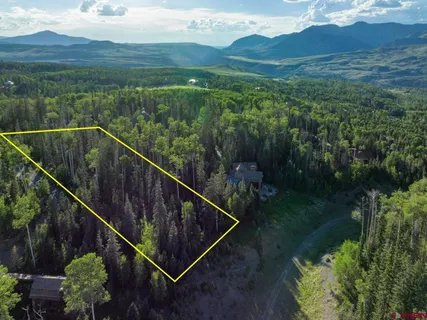a view of a city from a balcony with an outdoor space