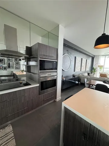 a view of hallway with livingroom and furniture