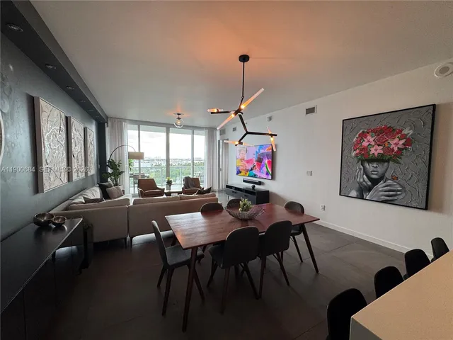 a bedroom with bed or couch and a large window