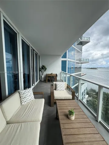 a view of swimming pool with outdoor seating