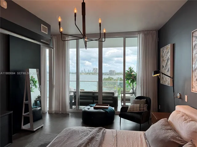 a view of a room with furniture and windows