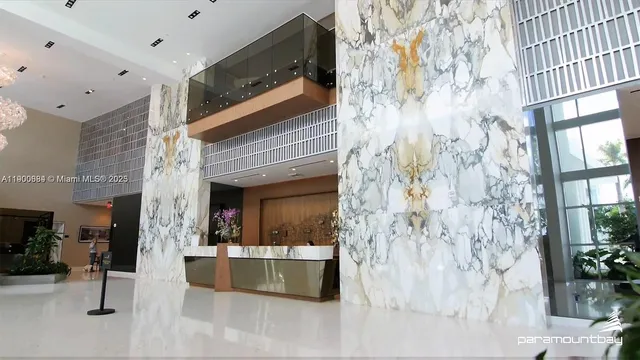 a view of living room with furniture and a flat screen tv