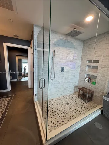 a living room with furniture potted plant and a window