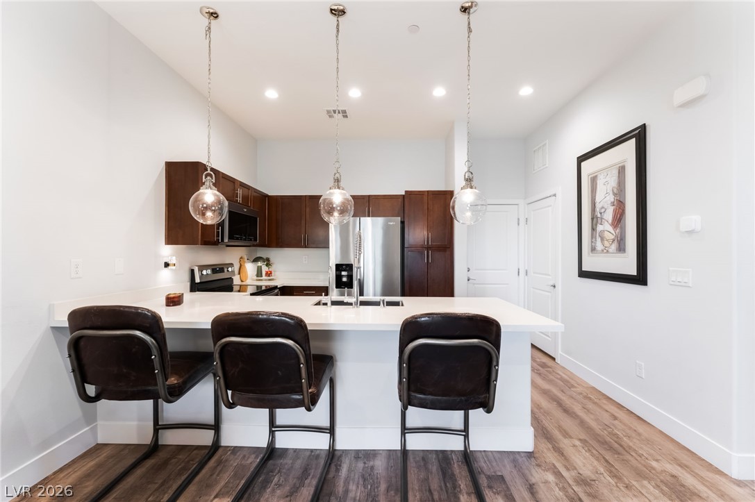 6432 Spring Jog Street Las Vegas, NV 89166 - Photo 10 of 61 Bright, airy kitchen with ample counter space and modern fixtures, perfect for casual dining.