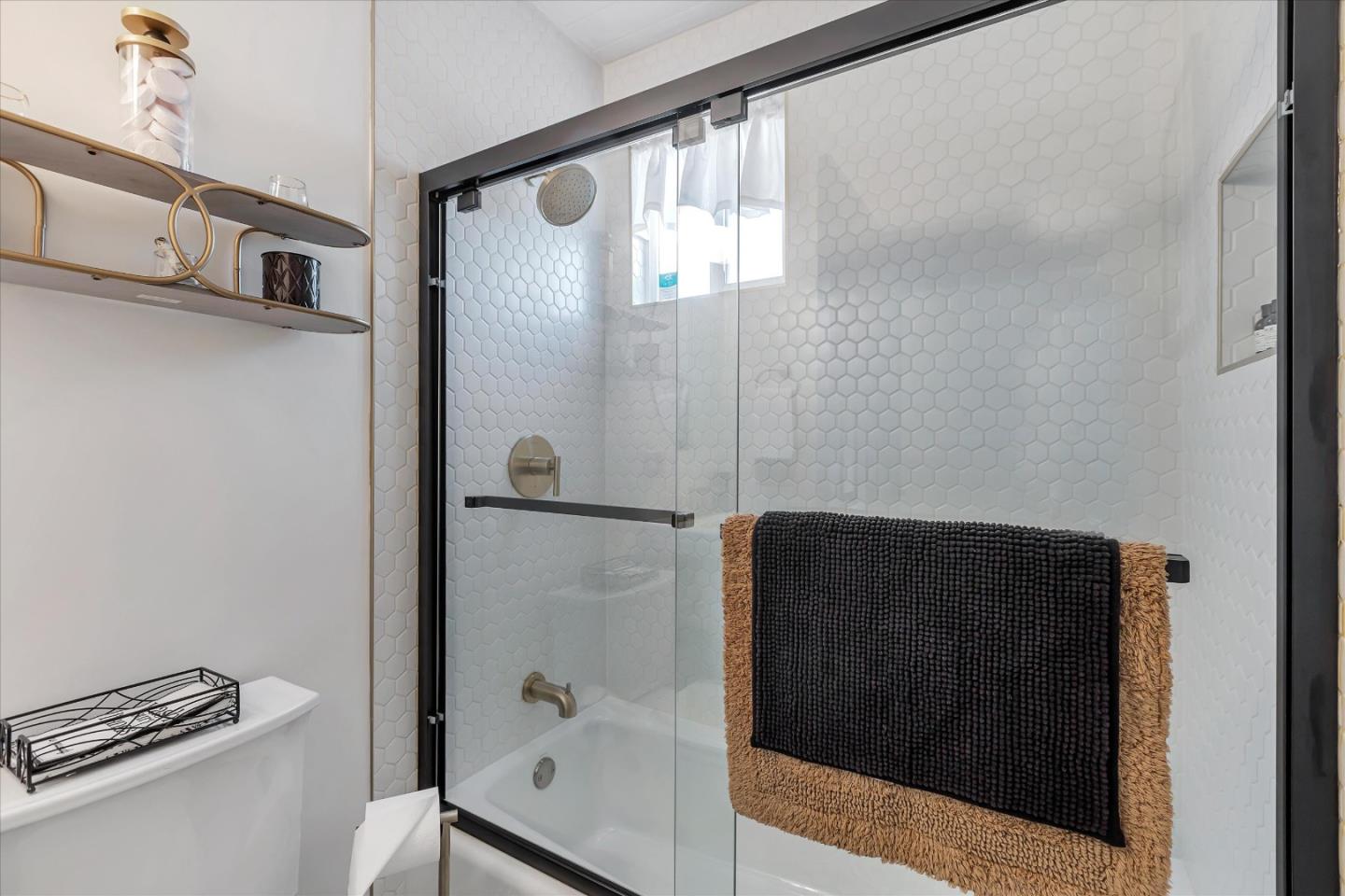 39 Carnegie Drive Milpitas, CA 95035 - Photo 28 of 39 a bathroom with a glass shower door