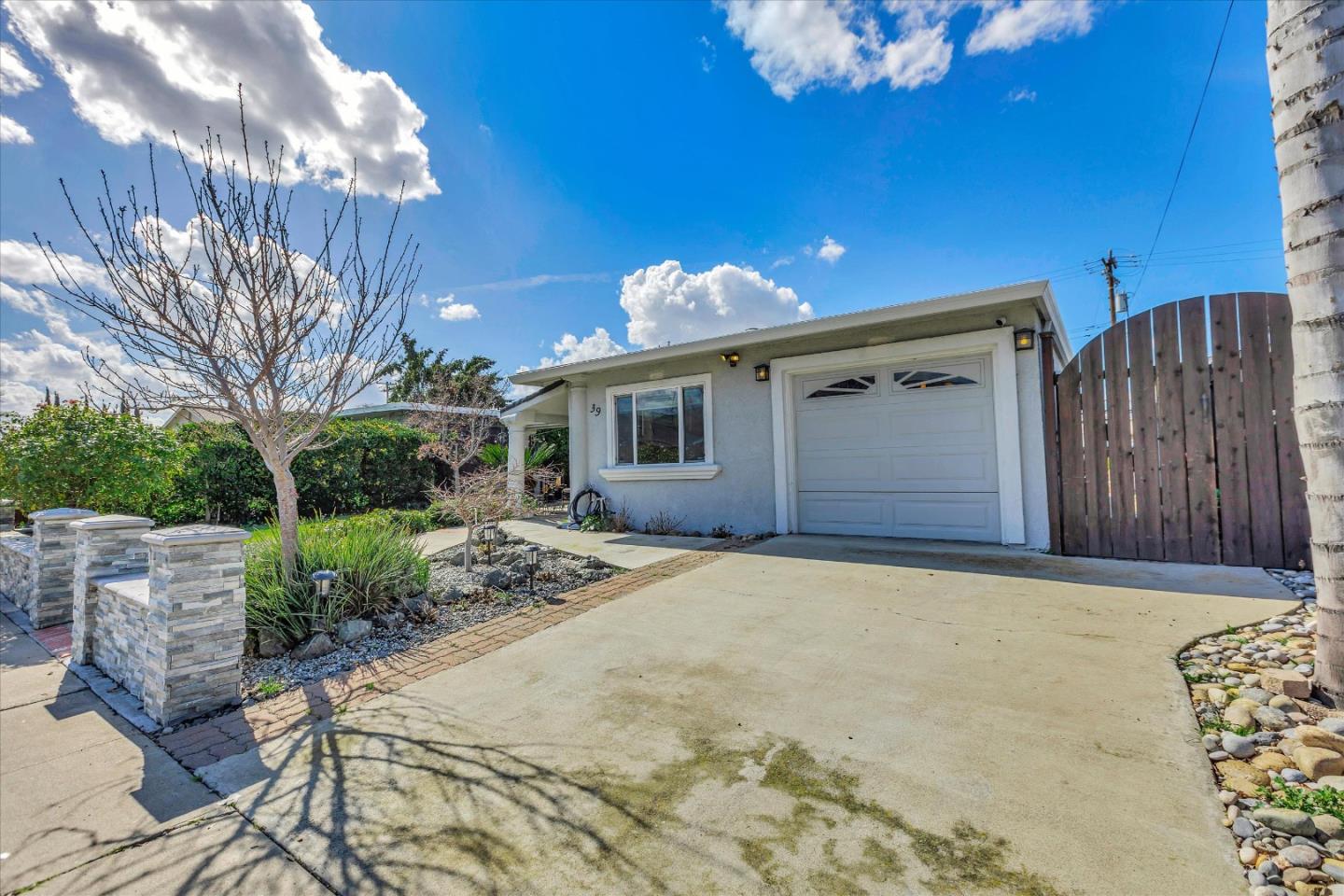 39 Carnegie Drive Milpitas, CA 95035 - Photo 38 of 39 a front view of a house with a yard and garage