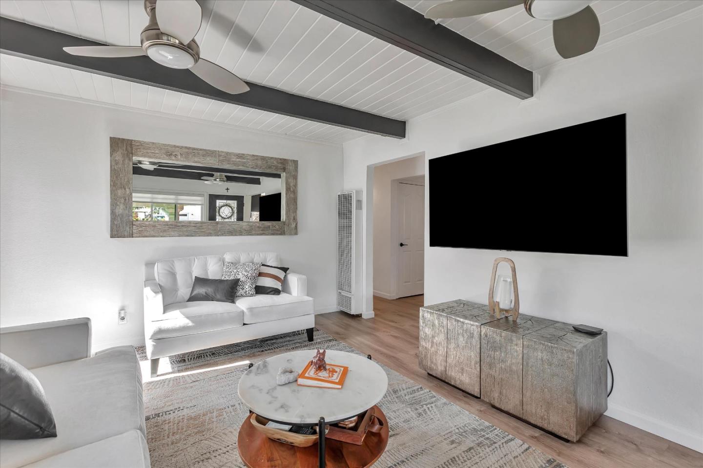 39 Carnegie Drive Milpitas, CA 95035 - Photo 6 of 39 a living room with furniture and a flat screen tv