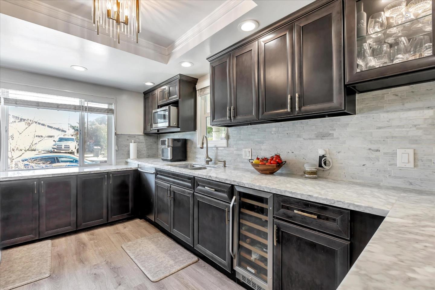 39 Carnegie Drive Milpitas, CA 95035 - Photo 8 of 39 a kitchen with stainless steel appliances granite countertop wooden cabinets a stove top oven a sink and dishwasher