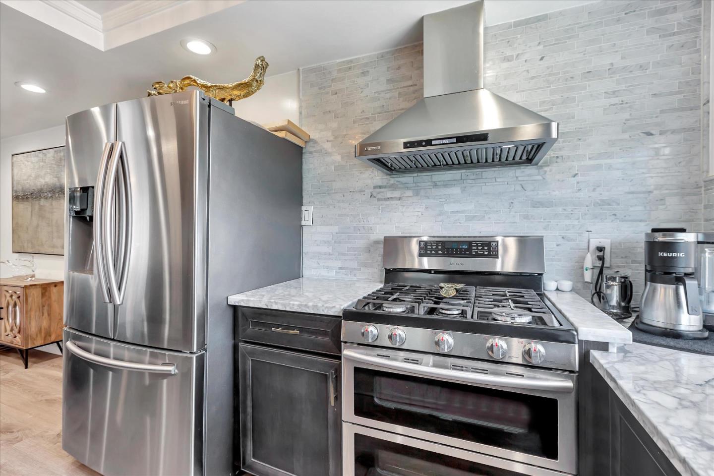 39 Carnegie Drive Milpitas, CA 95035 - Photo 9 of 39 a kitchen with granite countertop stainless steel appliances and a counter space