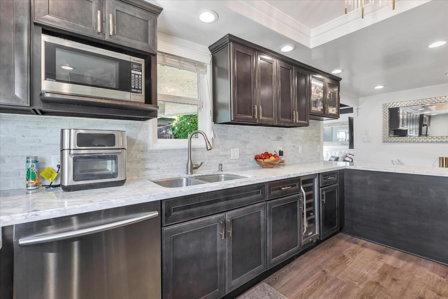 39 Carnegie Drive Milpitas, CA 95035 - Photo 10 of 39 a kitchen with stainless steel appliances a stove microwave and sink