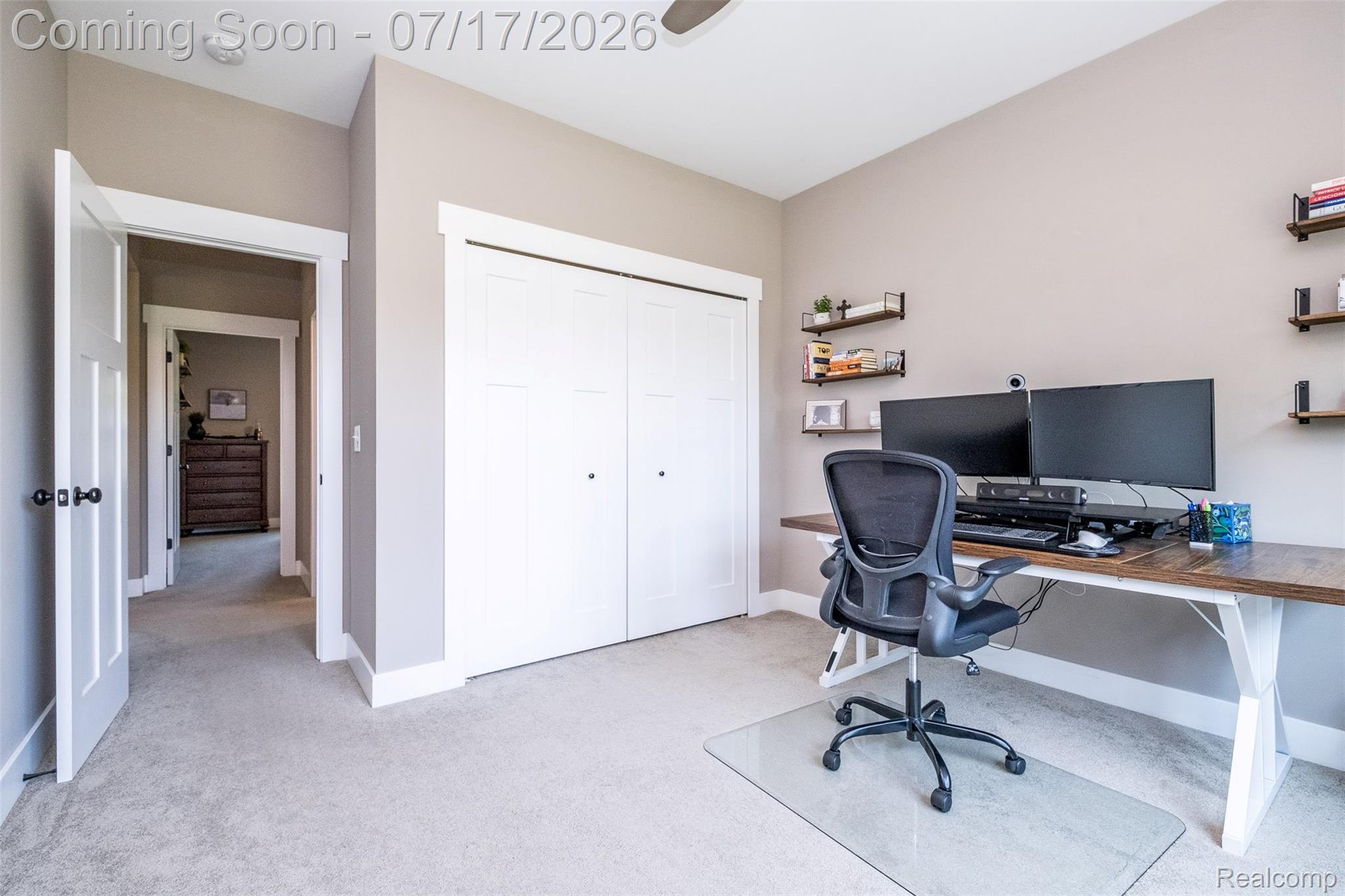12349 Sugar Maple Drive Fenton, MI 48430 - Photo 35 of 67 Carpeted room featuring a double-door closet, ceiling fan, and floating wall shelves