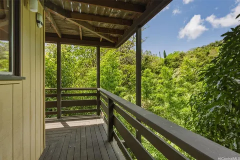 a view of balcony with wooden floor