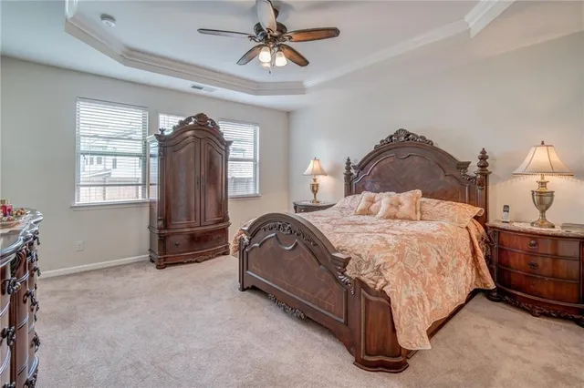 a bedroom with a bed dresser and a window