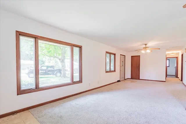 a view of an empty room with a window