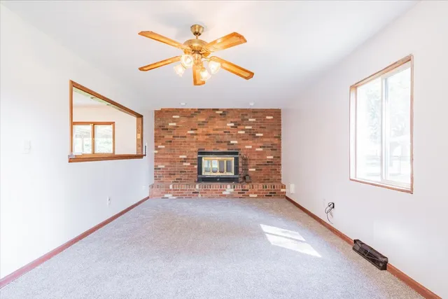 a kitchen with a refrigerator a stove top oven and cabinets